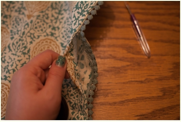 A small hole in the side of a DIY placemat pillow.