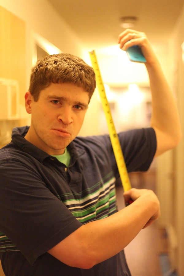 take time to have fun during a home renovation - Scott's playing around with a tape measure