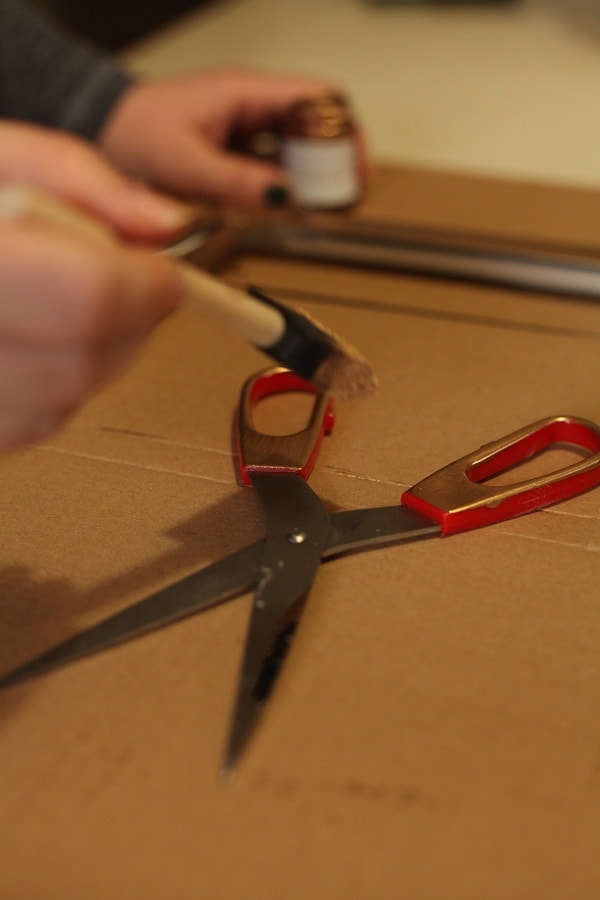Painting red scissors gold 