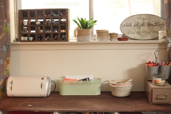 Baskets and vintage organizers displayed in a studio reveal.