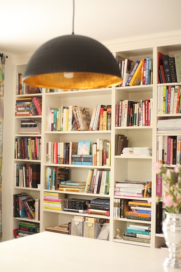 IKEA hack billy bookcases filled with books.