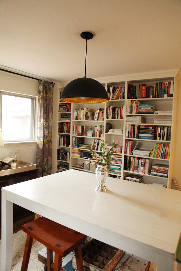 A craft room reveal after a renovation featuring bright and bold decor and lots of books!