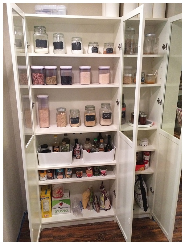 Ikea pantry cabinet filled with containers of food