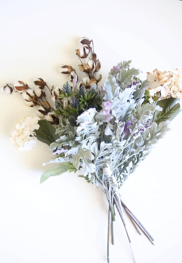 A bouquet of fall flowers and greenery 