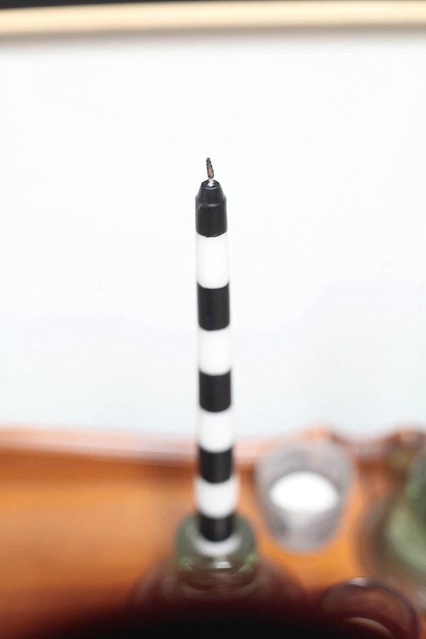 white and black candle stick