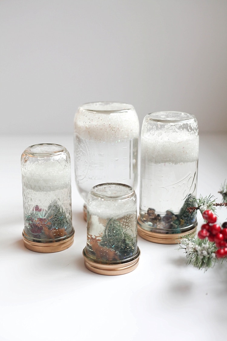 4 snow globe mason jars with Christmas decor