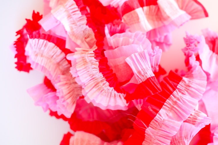 What a cool way to use crepe paper to decorate for Valentine's Day! Totally doing this, they are like $1 each! Love!