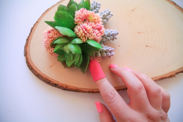 This diy faux succulent and wood centerpiece is gorgeous for a wedding, party or spring decor!