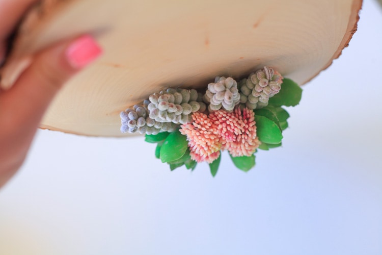This diy faux succulent and wood centerpiece is gorgeous for a wedding, party or spring decor!