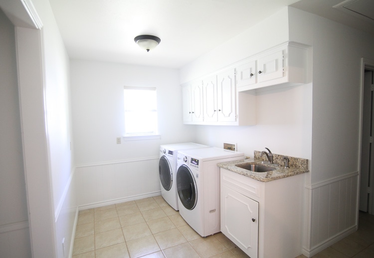 It's amazing what a few coats of white paint can do—this laundry room looks totally different!
