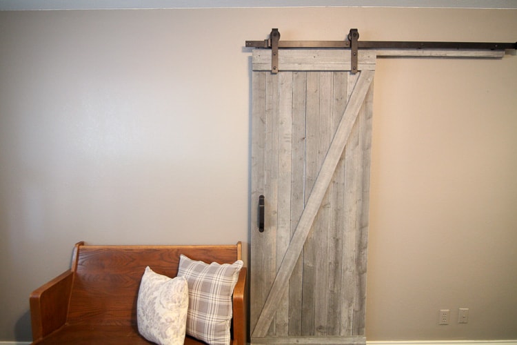 This easy to make rustic barn door is beautiful and easy to make! I love this for a touch of fixer upper style. Farmhouse is my favorite.