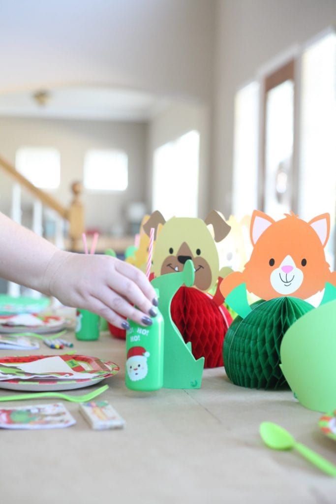 I LOVE the idea of a kids Christmas table! This decor is so cute and the entire thing cost less than $100. I really want to do a Christmas table for kids this year!