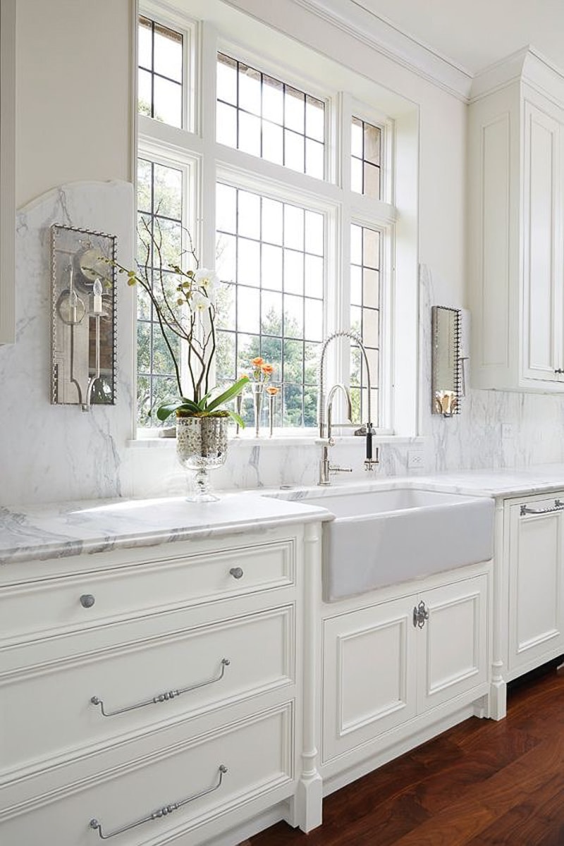 The white kitchen is my favorite! White cabinets and white counters are just so pretty and clean.