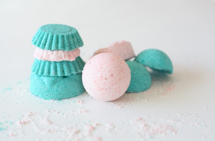 Stack of teal and pink bath bombs made with the lush bath bomb recipe