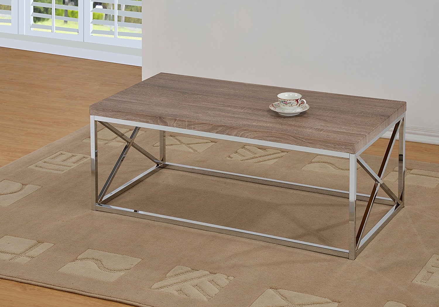A rectangular chrome and wood coffee table 
