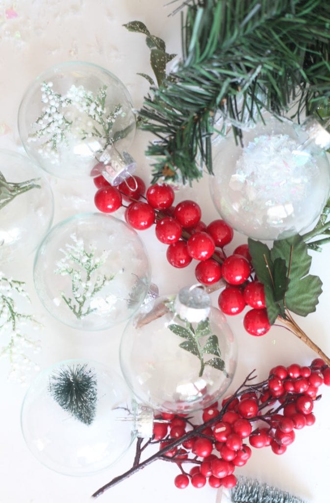 This easy diy christmas ornaments take a minute or less to put together! I've been searching for a new way to use clear glass ornaments...love this rustic idea!