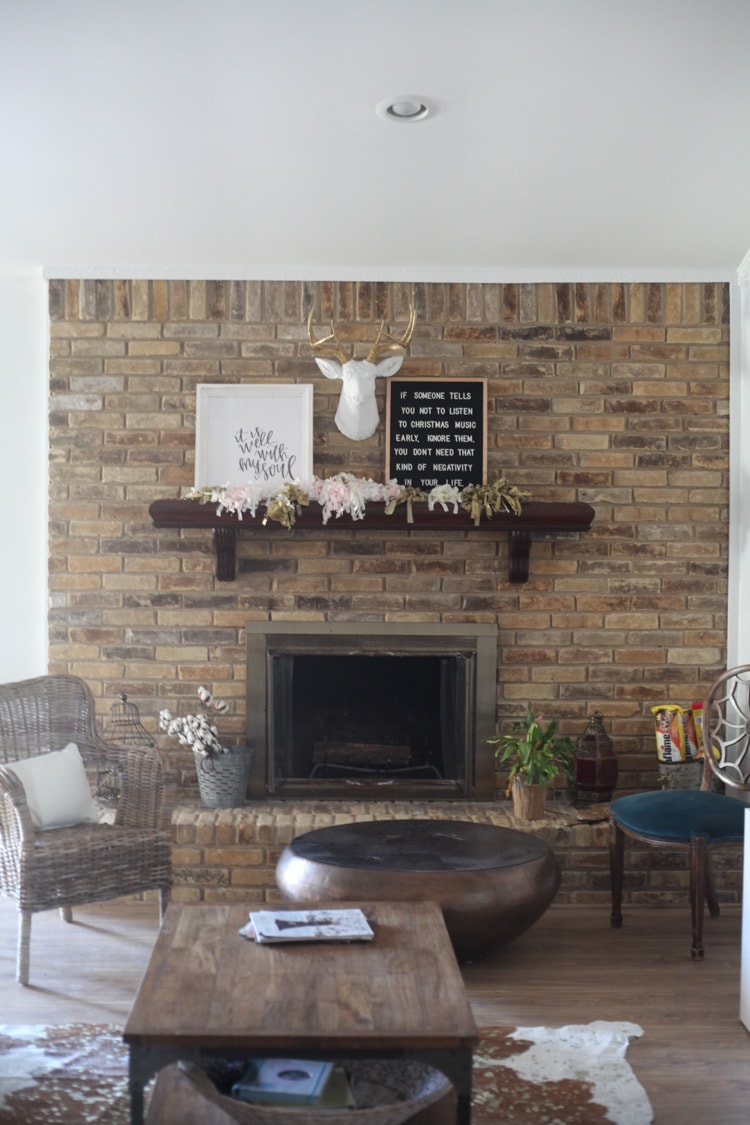 This living room makeover on a budget is awesome! I love the bright, white walls and the brick fireplace. This is one of my favorite sites for before and after home renovations. 