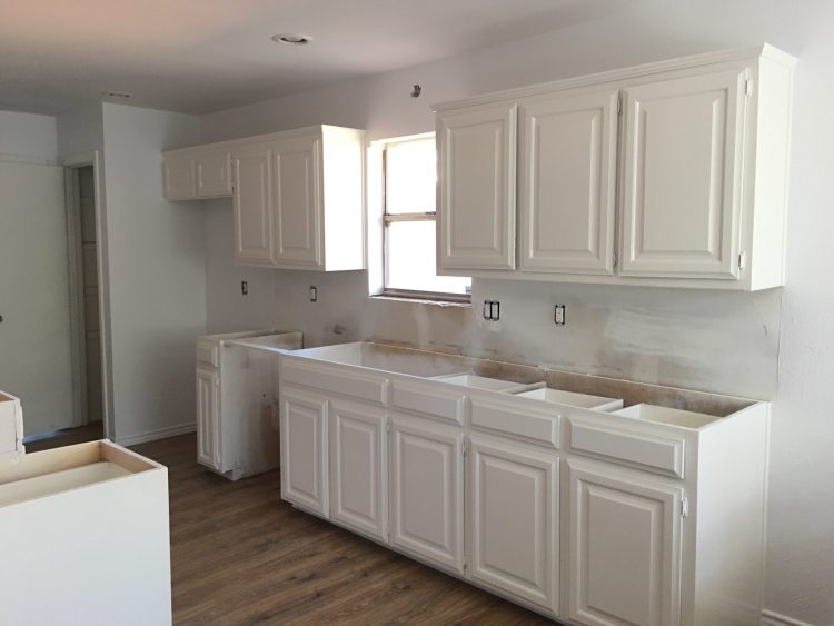 wall of painted white kitchen cabinets