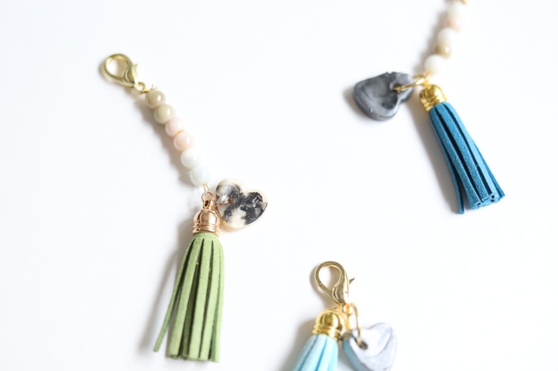 3 tasseled custom keychains with thumprint pendants