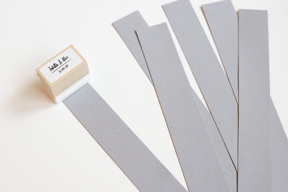 stamping gray strips of paper