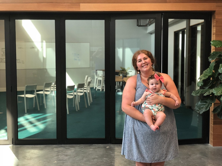 glass wall patio doors with woman and baby