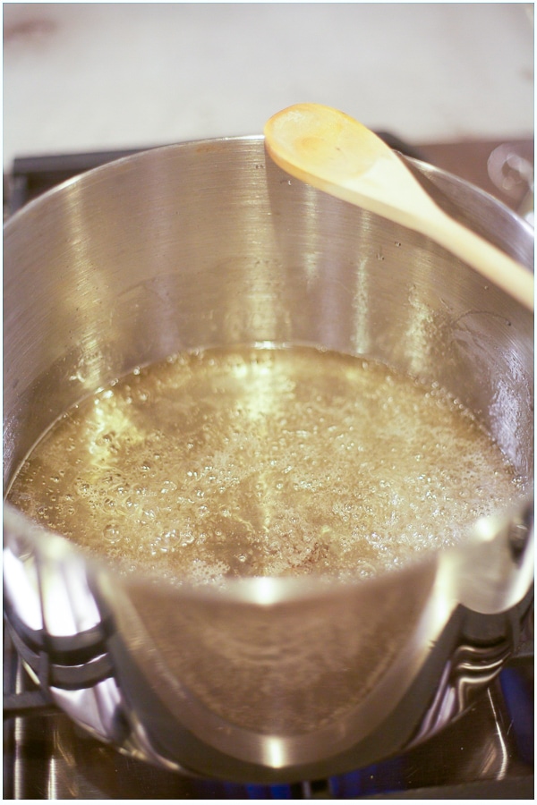 Water and sugar boiling in a large stockpot. 
