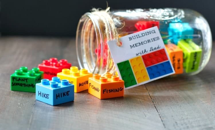 legos with activity ideas written on them in a jar