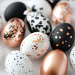 black, rose gold and white painted eggs