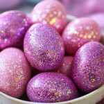 pink glittered eggs in a bowl