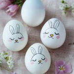 cute bunny heads hand drawn onto eggs