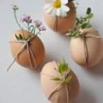 natural eggs with florals tied on with twine