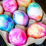 marbled tie dye eggs in a carton