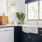 blue and white kitchen with white dishwasher