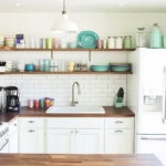 casual kitchen with white french door refrigerator
