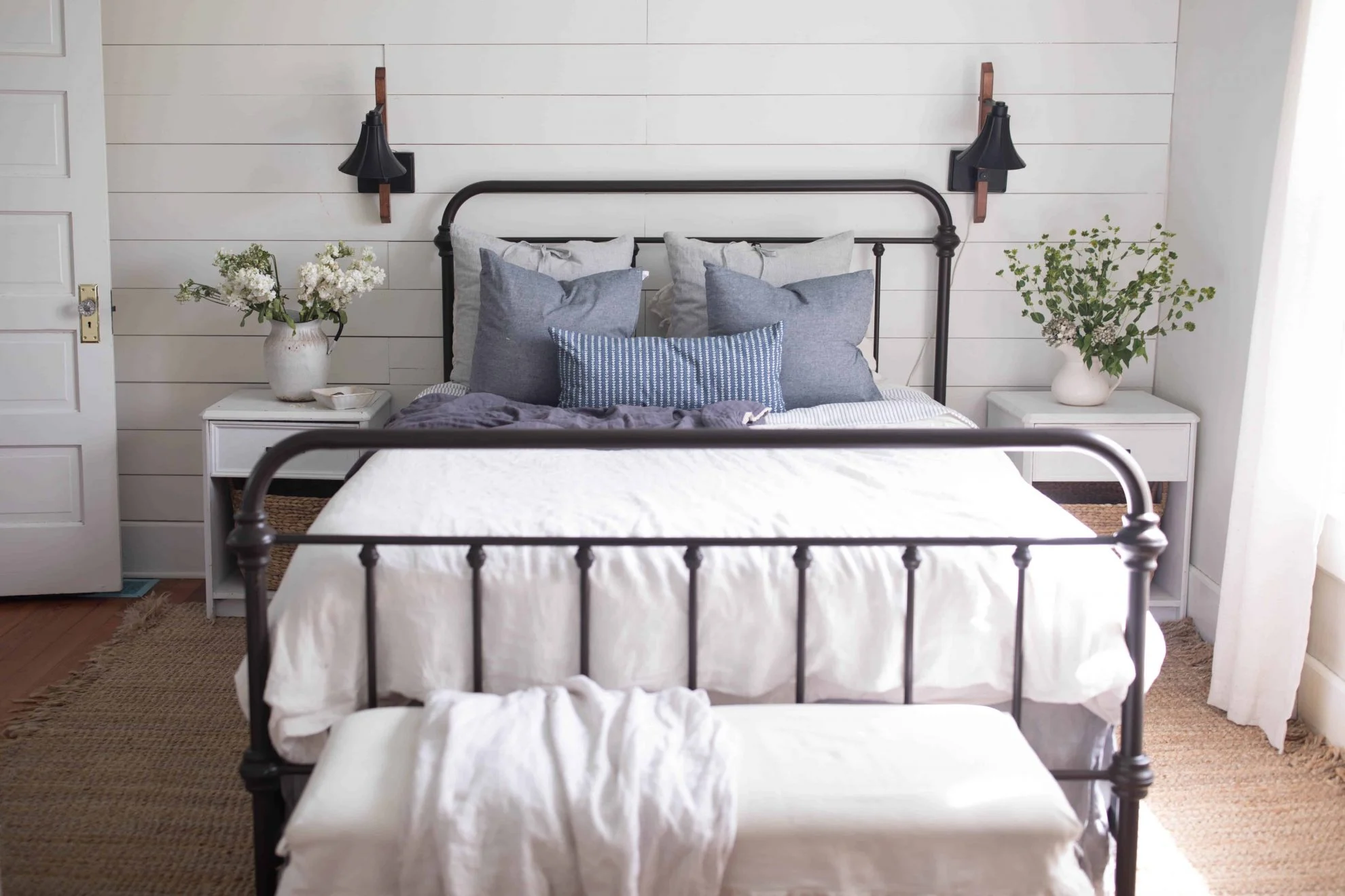 Farmhouse chic decor guest bedroom with shiplap wall painted in Benjamin Moore White Dove