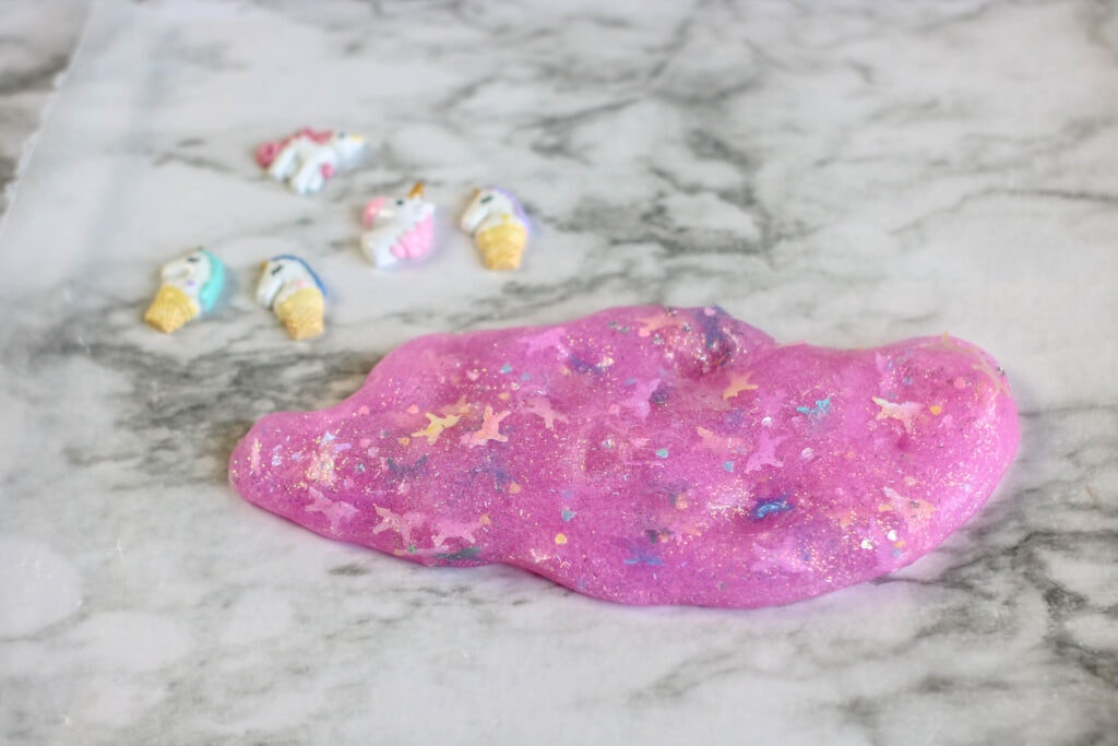 Add small toys to unicorn slime to make it more fun!