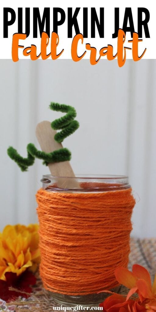 Pumpkin jar craft with orange string, popsicle stick and green pipe cleaner for DIY Halloween decoration ideas.