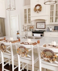 Wreaths on the back of kitchen chairs.