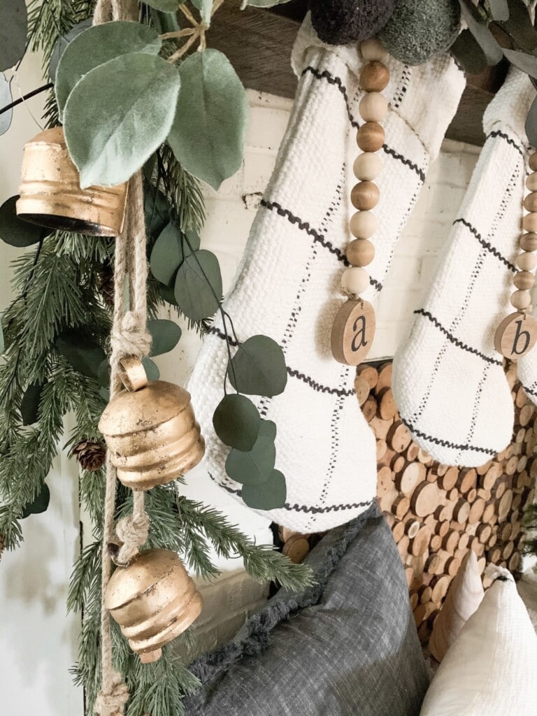 using natural wood and leaf elements in holiday mantel decor
