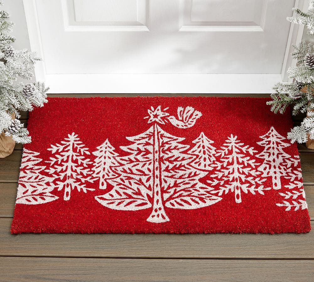 white nordic christmas trees on a red outdoor rug