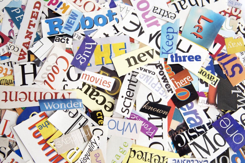 Colorful words cut out from magazines form an attractive background