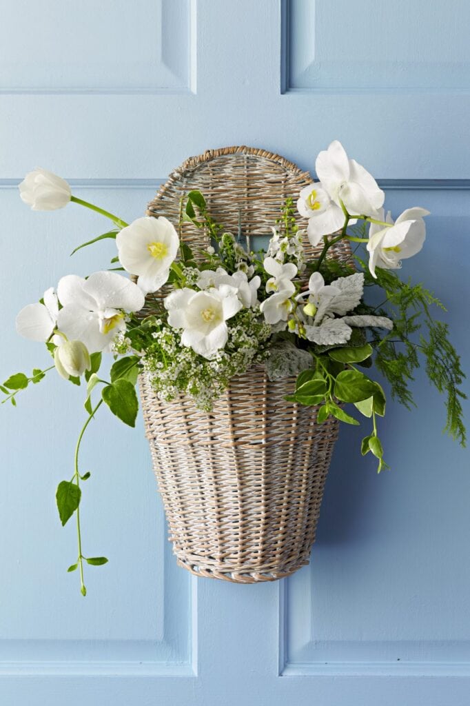 hanging basket with floral and greenery arrangement