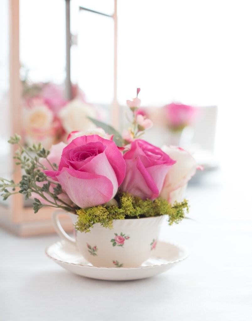 tea cups holding flower arrangements