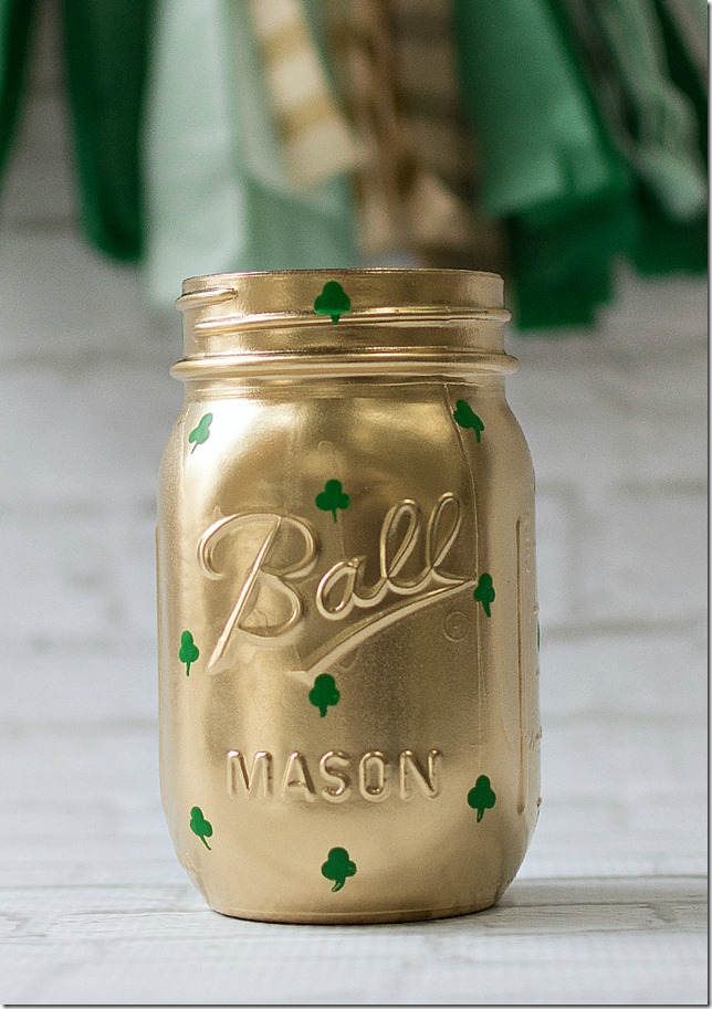 gold-painted mason jar with green shamrocks