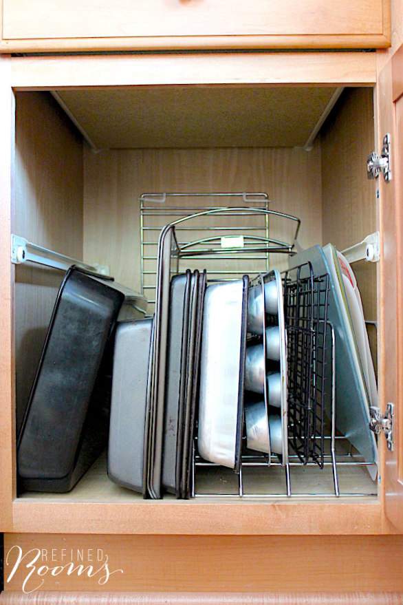 rack for kitchen with baking sheets and muffin pans vertically inside