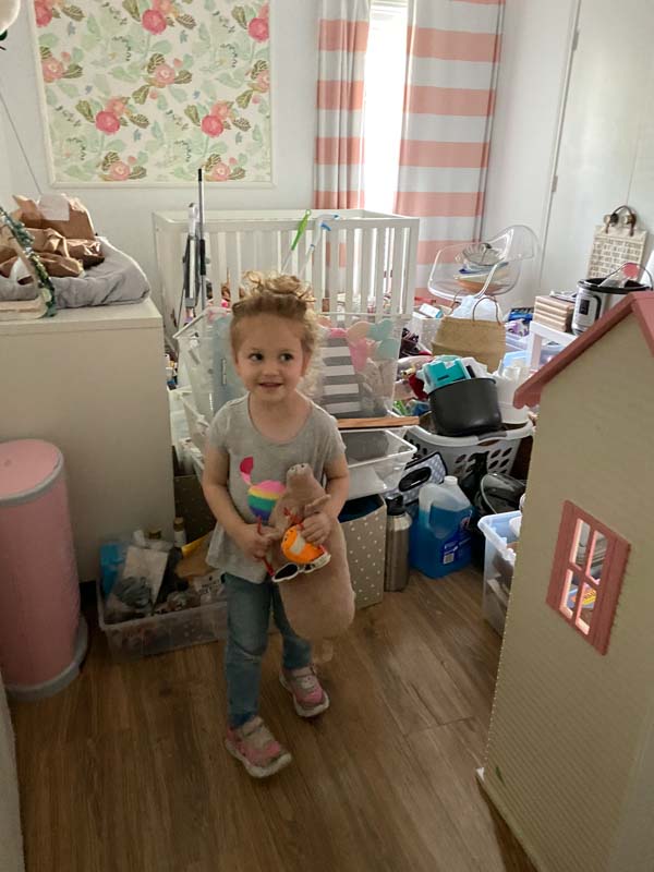 Little girl standing in a room that is undergoing a remodel transformation.