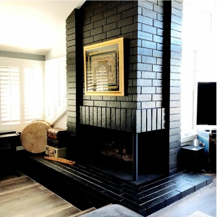 Fireplace painted with glossy black paint