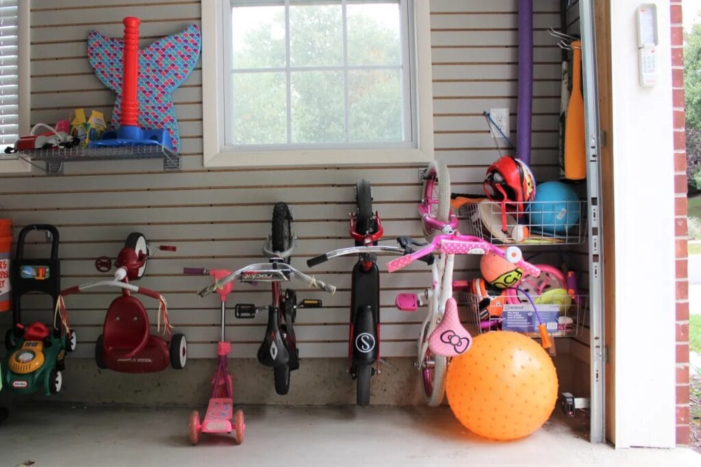 DIY slat wall in the garage holding bikes on hooks