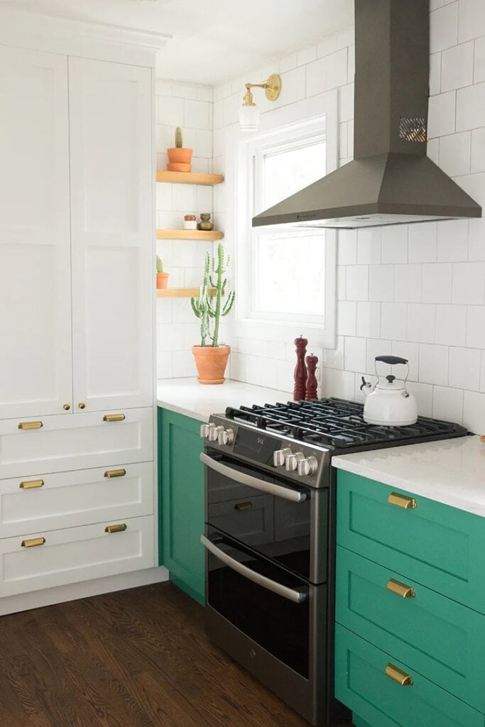 jewel toned green lower cabinets in a two toned kitchen