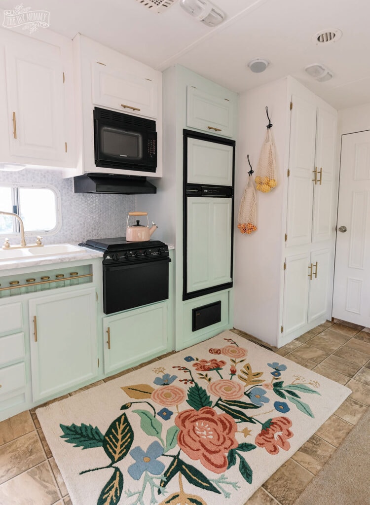 mint green two tone cabinets in a camper